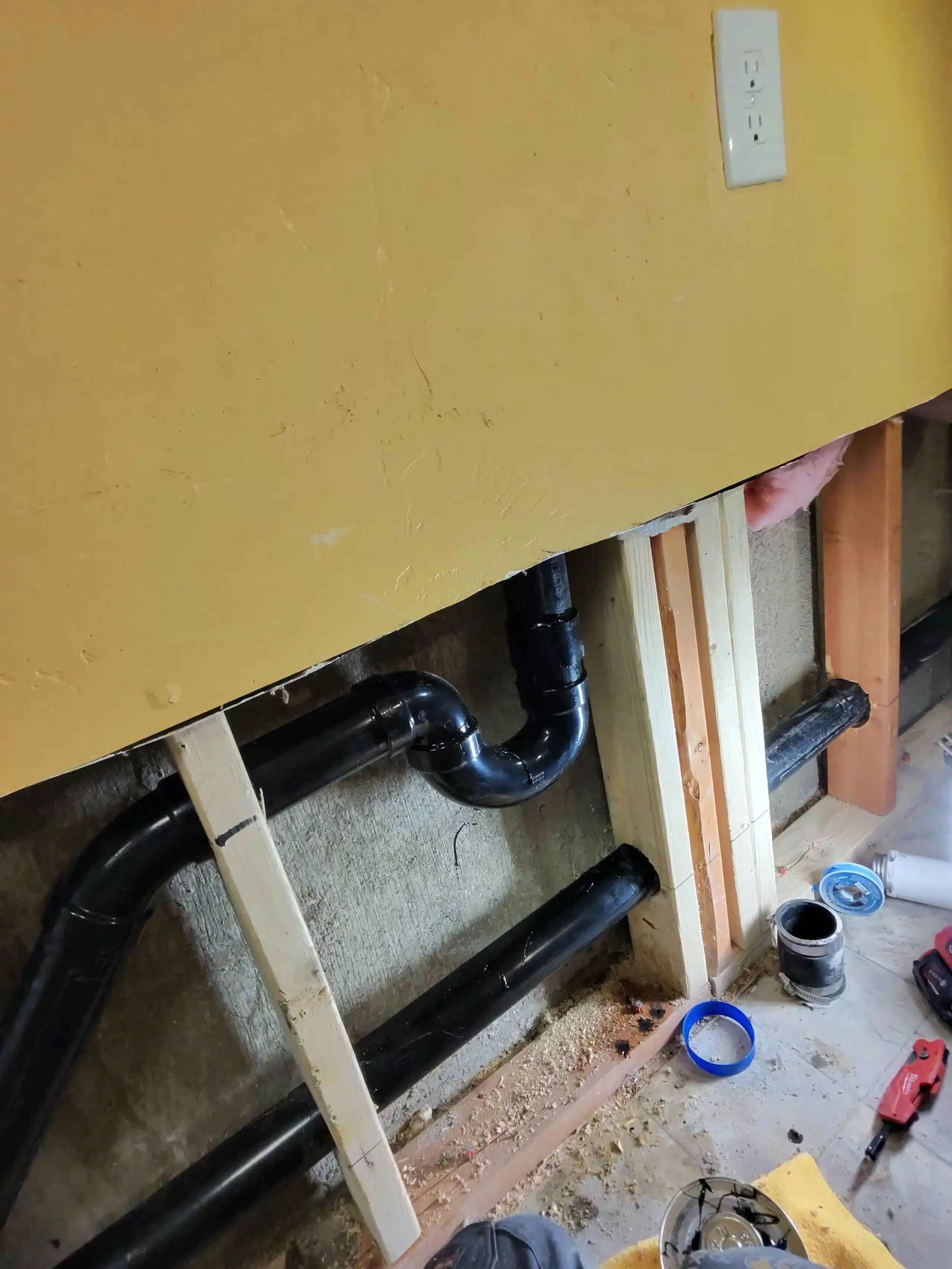 plumbing repair includes fixing broken water pipes in the wall